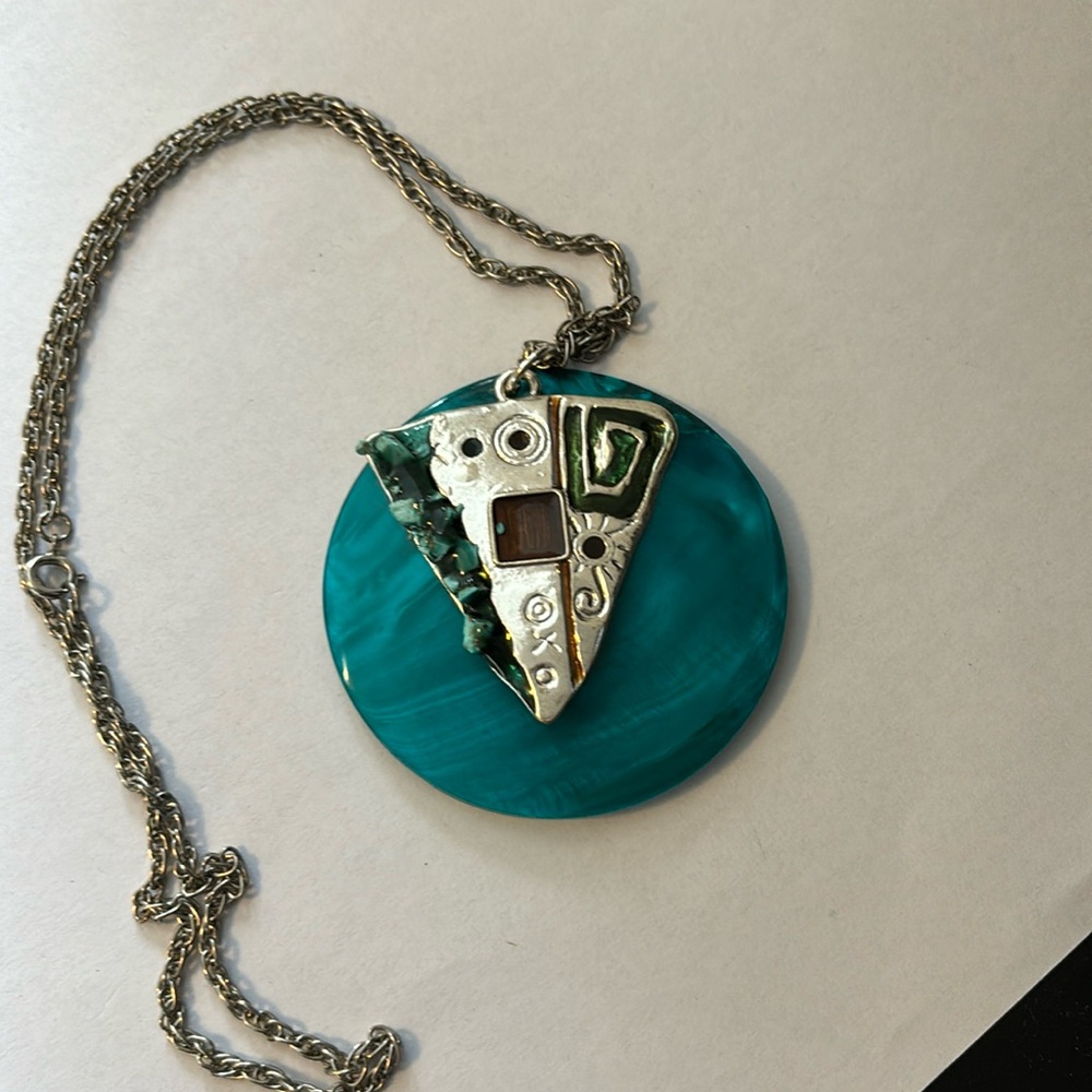 Large dyed turquoise shell pendant on 24” silver tone rope chain
